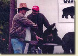 Clarence LeBlanc and valued customer with Black Bear